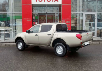 Подержанный автомобиль Mitsubishi L200 2011 года (7 фото)