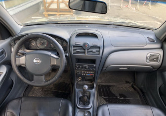 Подержанный автомобиль Nissan Almera Classic 2006 года (10 фото)