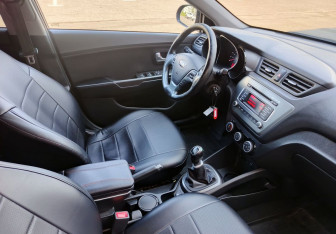Подержанный автомобиль Kia Rio Sedan 2015 года (13 фото)