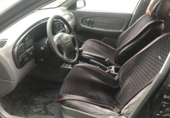 Подержанный автомобиль Kia Spectra Sedan 2006 года (9 фото)