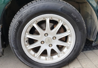 Подержанный автомобиль Toyota Corolla Sedan 2003 года (12 фото)