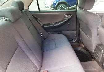 Подержанный автомобиль Toyota Corolla Sedan 2003 года (10 фото)