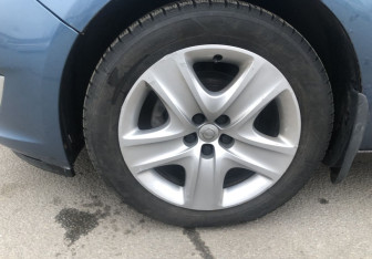 Подержанный автомобиль Opel Astra Sedan 2013 года (13 фото)