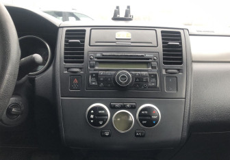 Подержанный автомобиль Nissan Tiida Sedan 2011 года (14 фото)