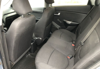 Подержанный автомобиль Kia Rio Sedan 2015 года (12 фото)