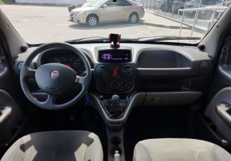 Подержанный автомобиль Fiat Doblo 2011 года (13 фото)