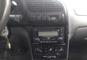 Подержанный автомобиль Kia Spectra Sedan 2006 года (12 фото)